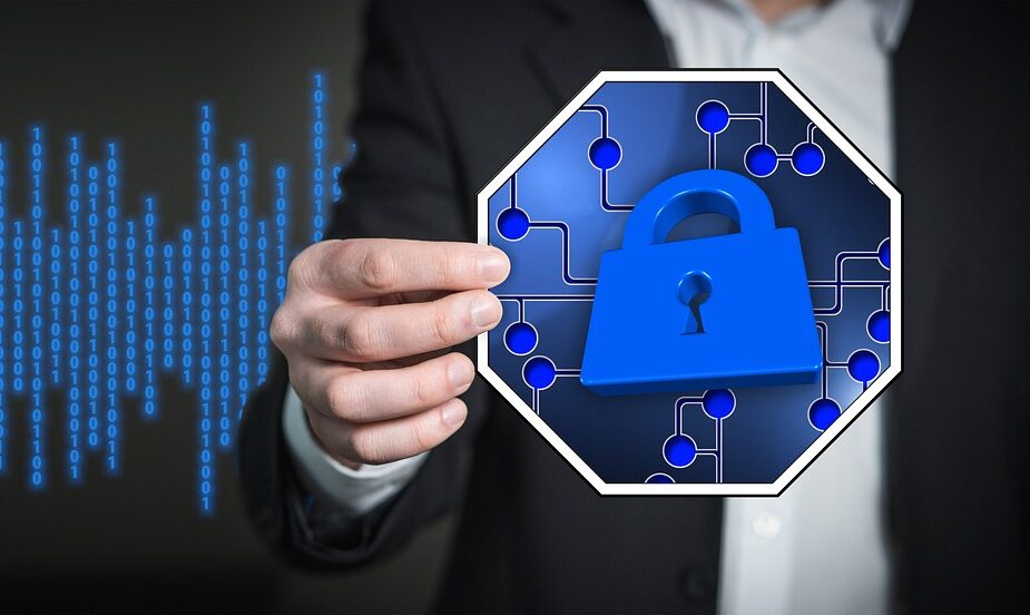 man holding image of a blue padlock with blue computer code behind him | What is penetration testing?