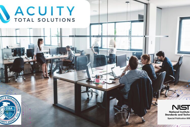 Wide angle photo of an office space with a half-dozen workers at their desks. | Cybersecurity Basics