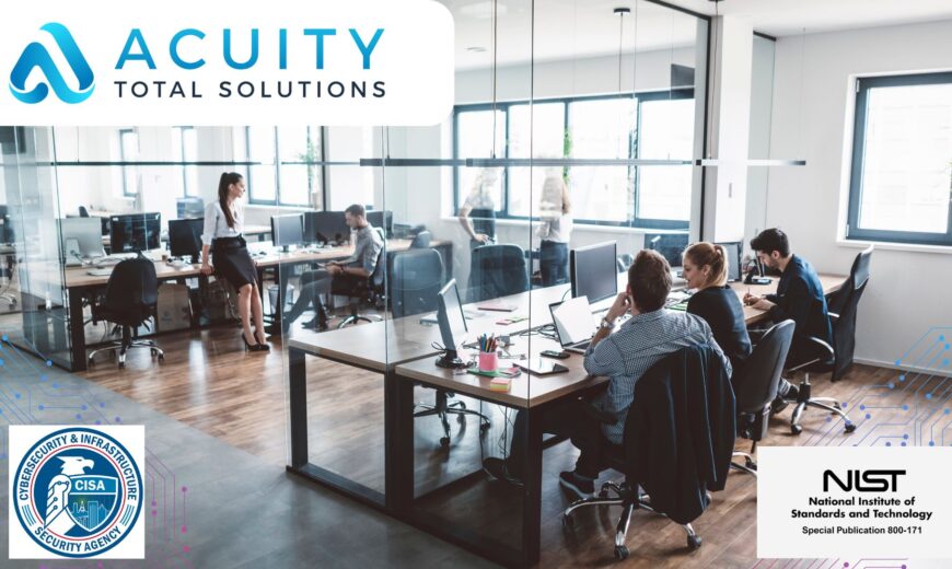 Wide angle photo of an office space with a half-dozen workers at their desks. | Cybersecurity Basics