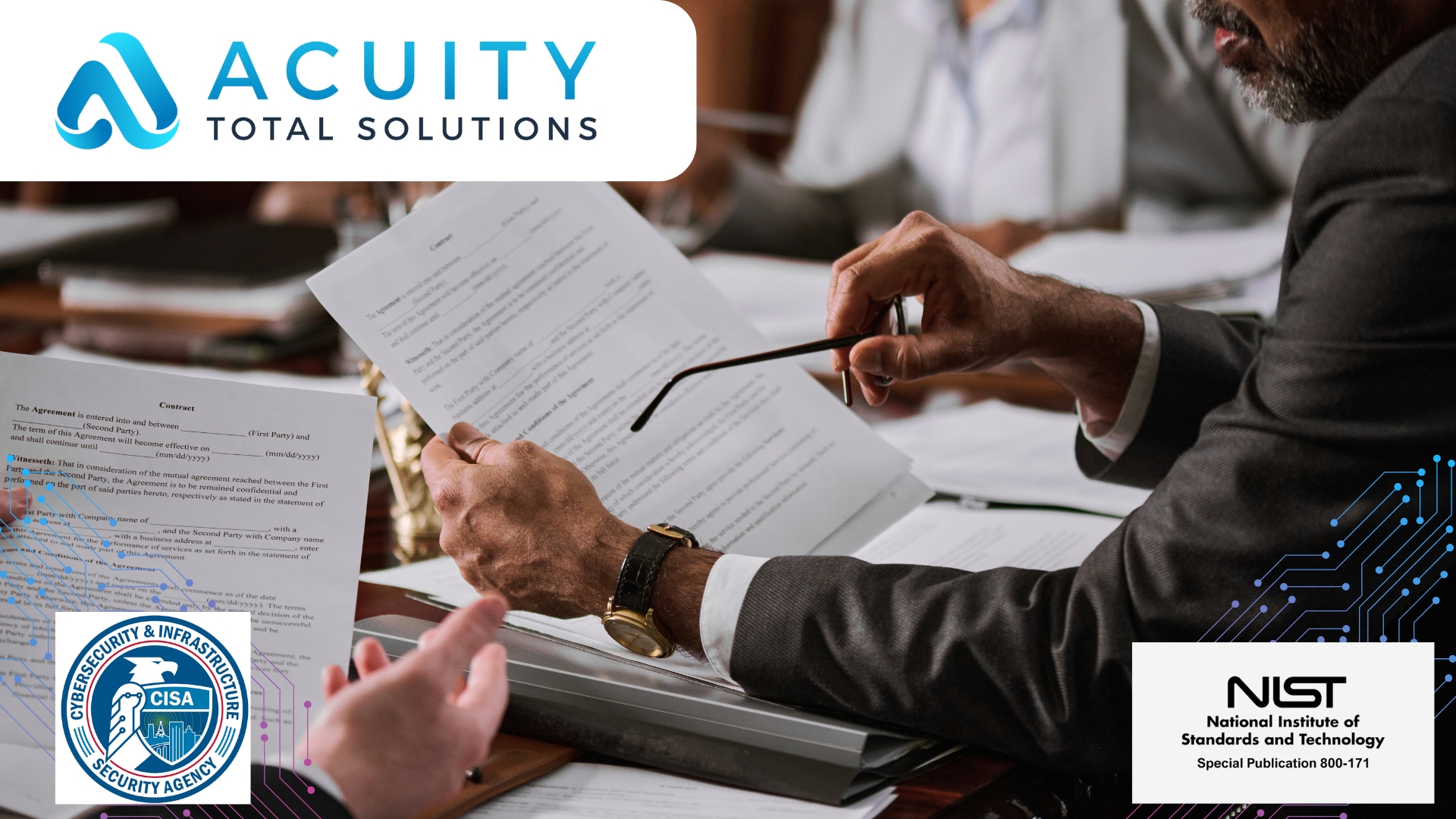 two people sit at a desk and review contract paperwork